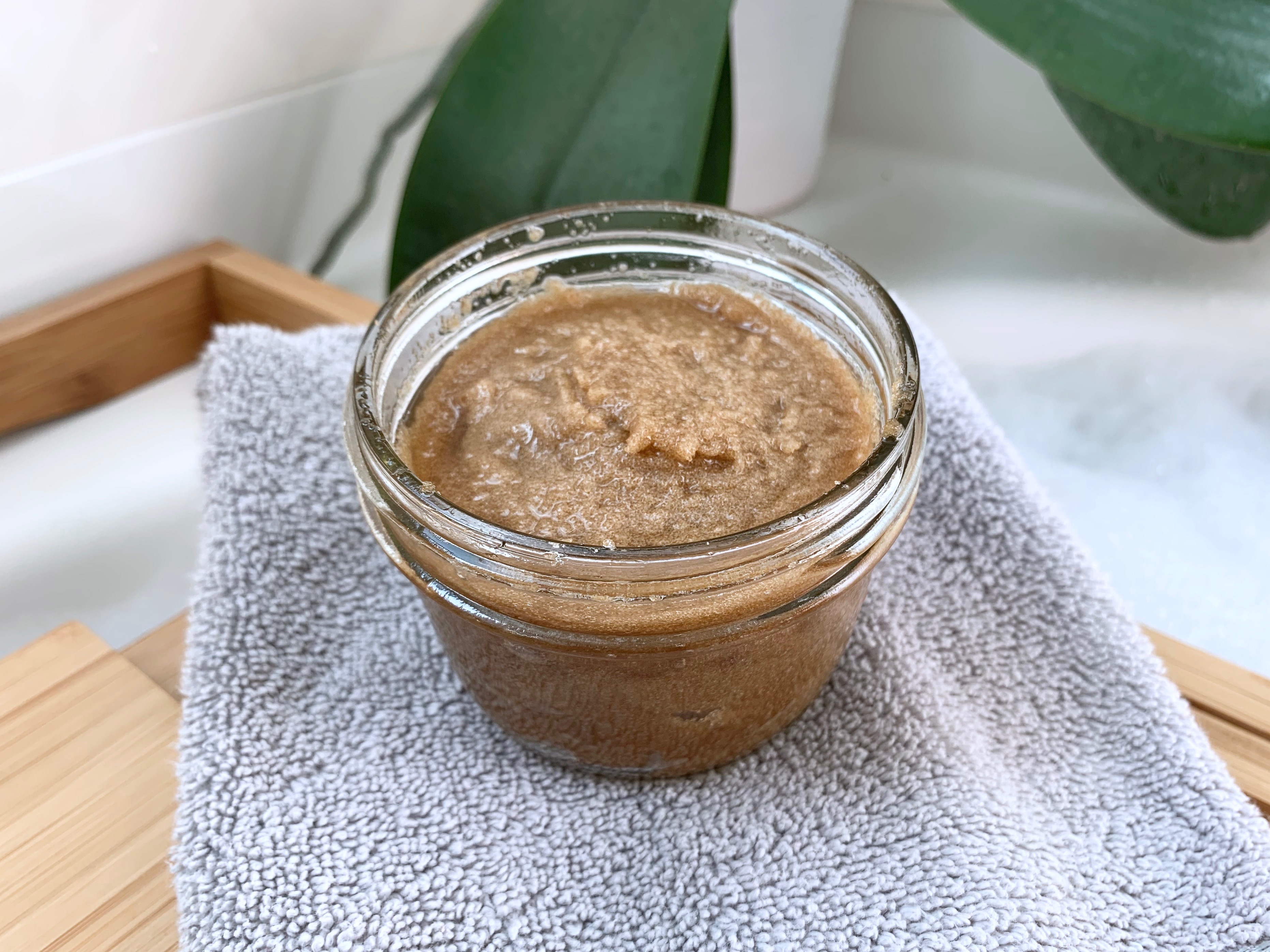 Find out how to make this super easy lavender sugar scrub. This sugar scrub has coconut oil, which is super nourishing for your skin, and brown sugar to help exfoliate. Lavender essential oil makes this scrub smell amazing and is a perfect way to help you relax and reduce stress. #DIY #DIYideas #bath #skincare #bodyscrub #sugarscrub #coconutoil #brownsugar #lavender #exfoliating